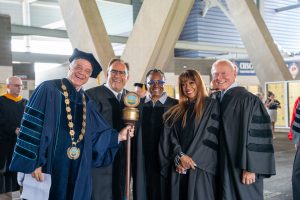 Goodwin University founder and president Mark E. Scheinberg in commencement regalia with honorary degree recipients Alan Lazowski, Janice Butler-Flemming, Bern Nadette Stanis, and Harry James.