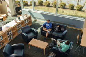 Aerial view of students sitting at study spots inside Goodwin’s Hoffman Family Library.