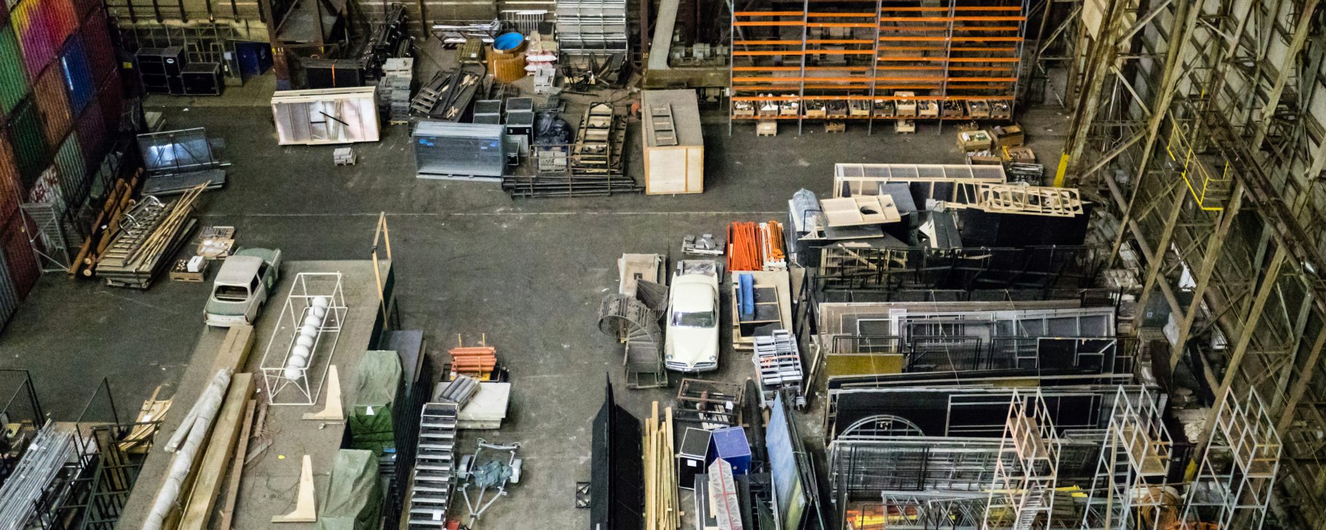 Manufacturing workers collaborating on advanced machinery in a modern production facility