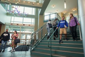 Goodwin University students walking up and down stairs