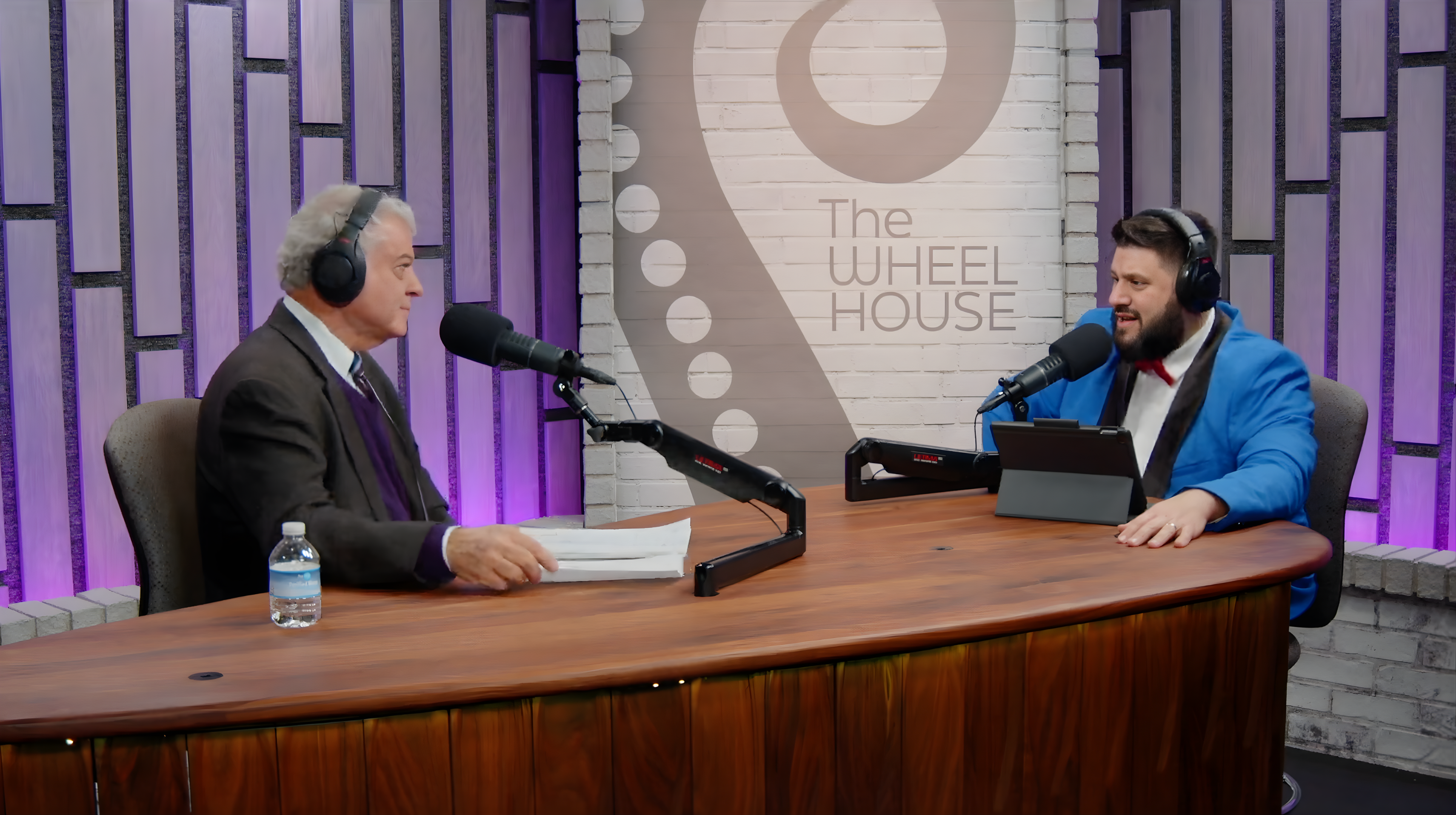 Goodwin University President Mark Scheinberg and Frankie Graziano sitting at a table with podcast microphones.