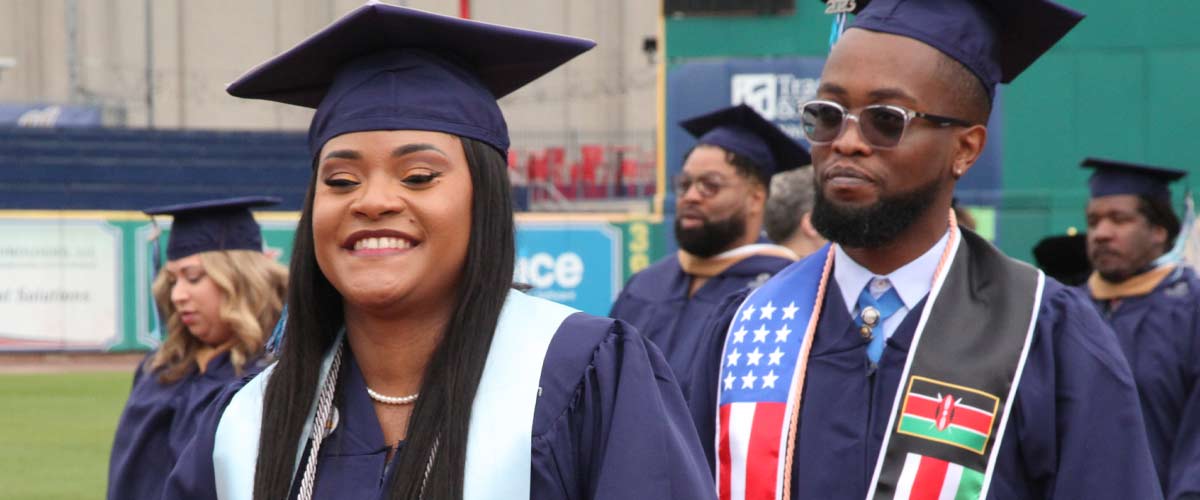 smiling grads walking