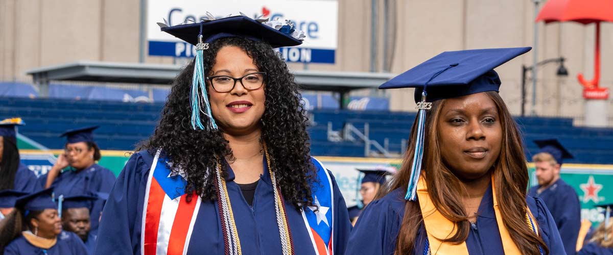 graduate walking to her seat