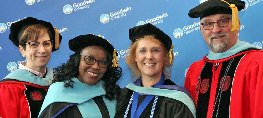 Three happy graduates at commencement