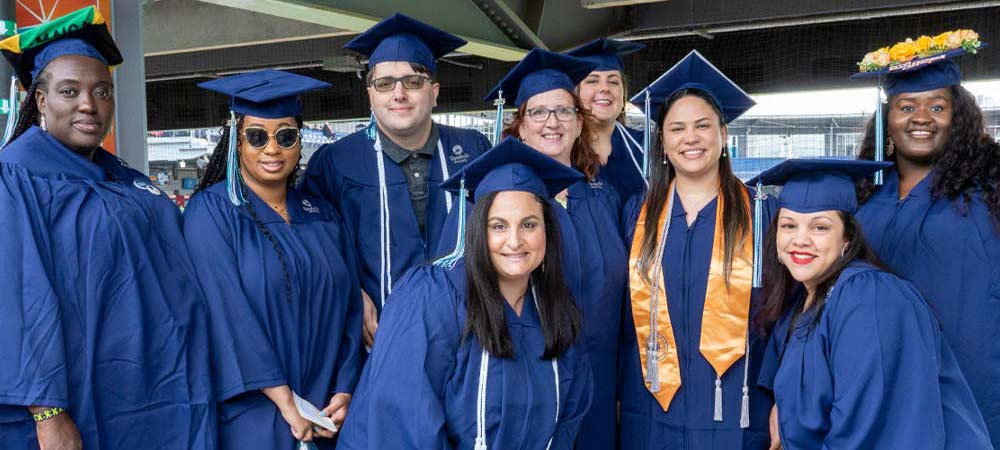 group of smiling graduates