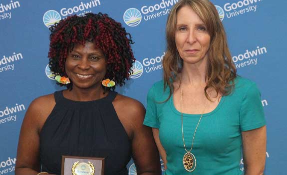 Susan Johnson holding an award