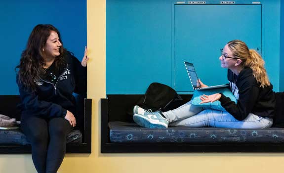 Students talking in the Goodwin student lounge