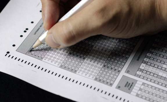 Closeup of a person filling out a scantron test
