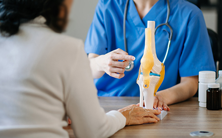 Elderly patient receiving joint therapy