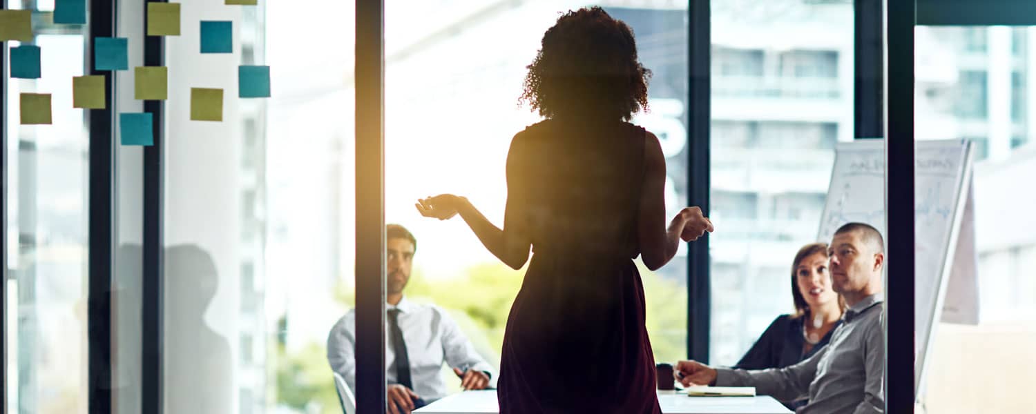 professor speaking to a group of Business Administration students