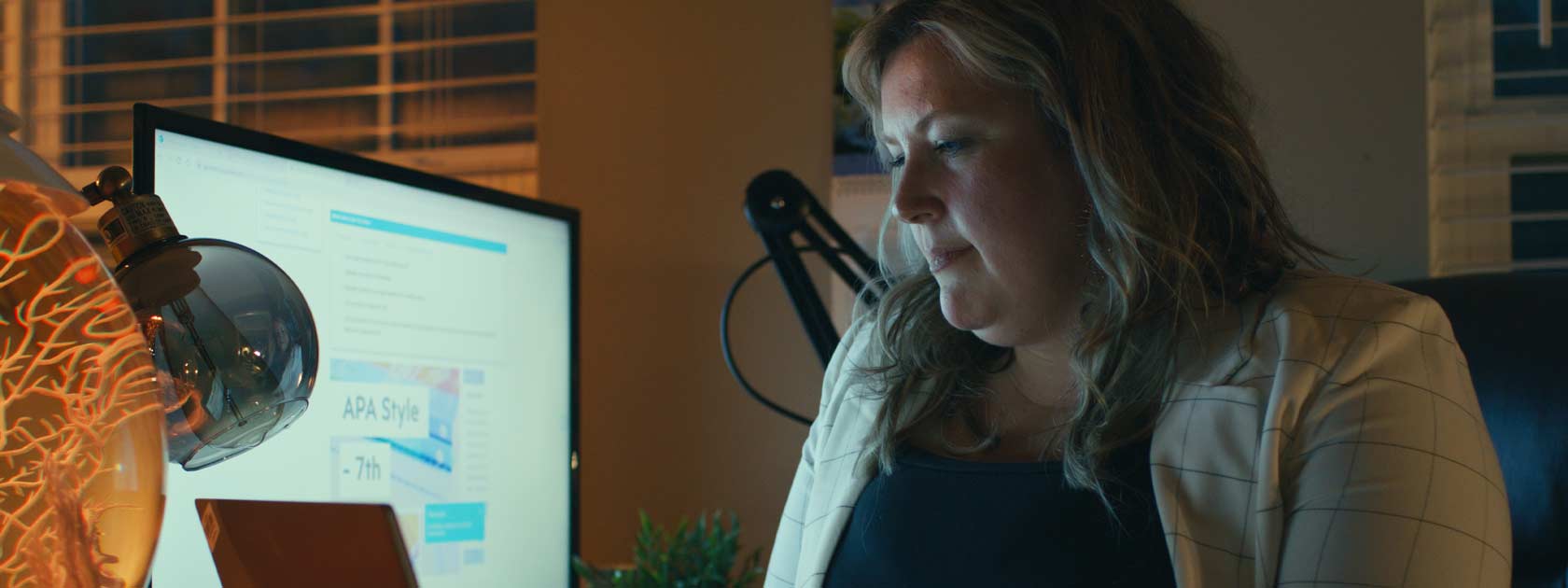 PMHNP student working on their computer