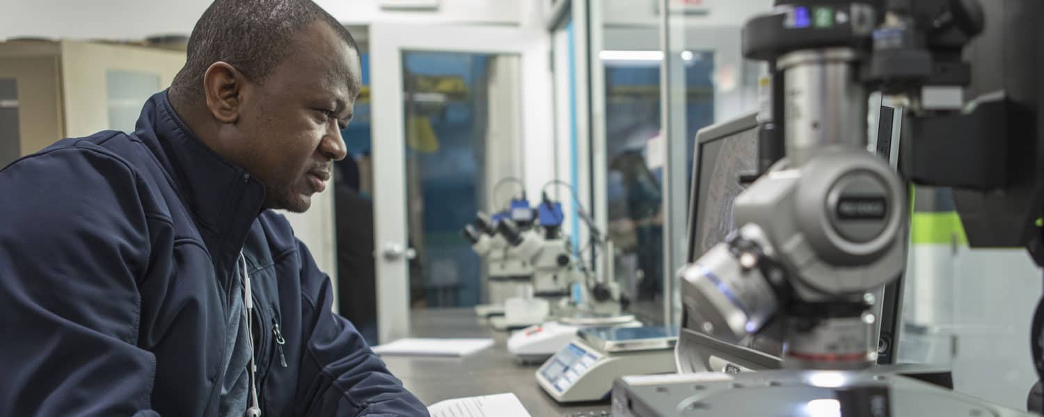 Quality Management student checking measurements