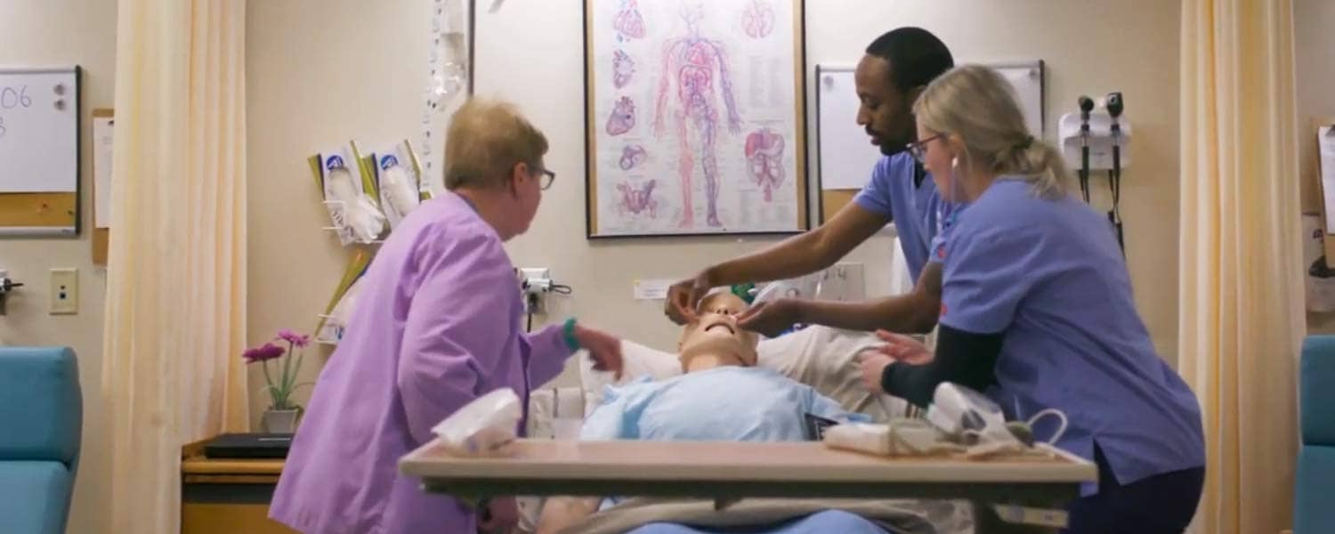 Nursing students working in the SIM lab